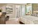 Bright bedroom featuring soft natural light, a comfortable queen bed, and stylish modern decor at 3341 N Buchanan Way, Aurora, CO 80019