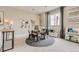 Bedroom features a round rug, a writing desk, and natural lighting at 3341 N Buchanan Way, Aurora, CO 80019
