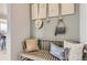 Charming entryway nook with light green walls and a wooden bench with pillows at 3341 N Buchanan Way, Aurora, CO 80019