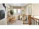 Bright loft space with neutral tones, built-in shelving, and plenty of natural light at 3341 N Buchanan Way, Aurora, CO 80019