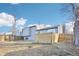 Backyard features a wooden fence that surrounds the premises, with mature trees at 19003 E Oxford Dr, Aurora, CO 80013