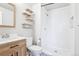 Modern bathroom featuring wood-look vanity, white shower, and stylish fixtures for a fresh, clean feel at 19003 E Oxford Dr, Aurora, CO 80013
