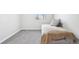 Well-lit bedroom with plush carpet, a comfortable bed, and a bright window for natural light at 19003 E Oxford Dr, Aurora, CO 80013