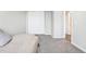 Cozy bedroom with neutral carpet, a closet, and ample natural light creating a comfortable space at 19003 E Oxford Dr, Aurora, CO 80013