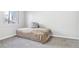 Bedroom with a bed, neutral carpet, and window, offering a simple and comfortable living space at 19003 E Oxford Dr, Aurora, CO 80013