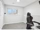 Bedroom features a large window for natural light and neutral walls perfect for customization at 19003 E Oxford Dr, Aurora, CO 80013