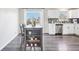 Stylish eat-in kitchen featuring a gray hardwood floor, an island, and stainless steel appliances at 19003 E Oxford Dr, Aurora, CO 80013