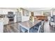 Open-concept floorplan features kitchen with stainless appliances flowing into the dining and living areas at 19003 E Oxford Dr, Aurora, CO 80013