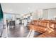 Cozy open concept living room area with luxury vinyl flooring flowing into the kitchen area at 19003 E Oxford Dr, Aurora, CO 80013