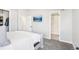 Comfortable main bedroom featuring soft carpet, ample closet space, and an en-suite bathroom at 19003 E Oxford Dr, Aurora, CO 80013