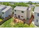Aerial view of a home backyard featuring a deck, lush lawn, and mature trees at 19463 E Hollow Creek Dr, Parker, CO 80134