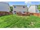 Lush backyard featuring a well-maintained lawn and a spacious wood deck for outdoor enjoyment at 19463 E Hollow Creek Dr, Parker, CO 80134