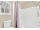Clean bathroom featuring a toilet and a shower/tub combination with neutral decor at 19463 E Hollow Creek Dr, Parker, CO 80134