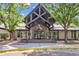 Beautiful community clubhouse featuring a unique architectural design and inviting entrance at 19463 E Hollow Creek Dr, Parker, CO 80134