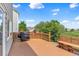 Beautiful backyard deck featuring a built-in bench and grill, perfect for outdoor entertaining at 19463 E Hollow Creek Dr, Parker, CO 80134