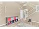 Inviting entryway with stairs, storage, and ample space for shoes and other items at 19463 E Hollow Creek Dr, Parker, CO 80134