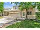 Charming two-story home with a well-manicured lawn and inviting entryway at 19463 E Hollow Creek Dr, Parker, CO 80134
