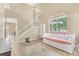 Bright living room with staircase, large windows, and elegant decor, creating a welcoming space at 19463 E Hollow Creek Dr, Parker, CO 80134