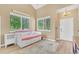 Sunlit room featuring a trundle daybed, light wood floors, and bright decor at 19463 E Hollow Creek Dr, Parker, CO 80134