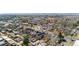 Wide aerial shot of a residential neighborhood with city buildings in the distance at 2146 Federal Blvd, Denver, CO 80211
