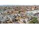 An aerial view of a charming Denver neighborhood showcasing mature trees, historic buildings, and a vibrant community at 2146 Federal Blvd, Denver, CO 80211