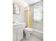 Compact bathroom featuring a shower-tub combo and vanity at 2146 Federal Blvd, Denver, CO 80211