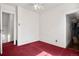 Bedroom featuring red carpet and a ceiling fan at 2146 Federal Blvd, Denver, CO 80211
