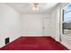 An empty bedroom with a ceiling fan and a large window at 2146 Federal Blvd, Denver, CO 80211