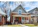 Quaint brick home with a cozy front porch, perfect for enjoying the neighborhood charm at 2146 Federal Blvd, Denver, CO 80211