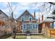 Exterior view of home with gray siding, brick accents, and small front yard at 2146 Federal Blvd, Denver, CO 80211