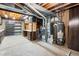 Basement mechanical room with shelving, cabinets, and HVAC equipment at 4653 Kirkwood St, Boulder, CO 80301