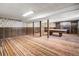Open basement area with pool table and colorful striped carpet at 4653 Kirkwood St, Boulder, CO 80301