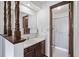 Small bathroom with basic vanity and enclosed shower at 4653 Kirkwood St, Boulder, CO 80301