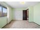 Bedroom with neutral carpet, light green walls, and a closet at 4653 Kirkwood St, Boulder, CO 80301