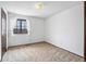 Simple bedroom with neutral carpet, window, and closet at 4653 Kirkwood St, Boulder, CO 80301