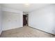 Bedroom with carpet, white closet, neutral walls and wood door at 4653 Kirkwood St, Boulder, CO 80301
