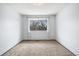 Bright bedroom featuring a window with natural light and neutral carpet at 4653 Kirkwood St, Boulder, CO 80301