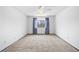 Simple bedroom with neutral walls and carpet with a window and ceiling fan at 4653 Kirkwood St, Boulder, CO 80301