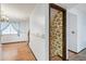 Hallway with unique wallpaper and wood-look flooring at 4653 Kirkwood St, Boulder, CO 80301