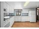 Bright kitchen with white cabinetry, modern appliances, and ample counter space at 4653 Kirkwood St, Boulder, CO 80301