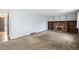 Open living room with a fireplace and bookshelves, providing a versatile living space at 4653 Kirkwood St, Boulder, CO 80301