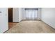 Large living room with neutral carpet and white walls at 4653 Kirkwood St, Boulder, CO 80301