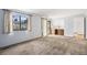 Bright living room featuring neutral walls and carpet, with sliding doors to the outside at 4653 Kirkwood St, Boulder, CO 80301