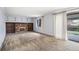 Cozy living room with a brick fireplace and built-in shelving, creating a warm ambiance at 4653 Kirkwood St, Boulder, CO 80301