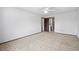 Large bedroom with neutral carpet, white walls, and a closet at 4653 Kirkwood St, Boulder, CO 80301