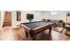 Spacious finished basement featuring a pool table and entertainment area at 1600 Olive St, Denver, CO 80220
