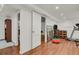 Basement area with laminate flooring, workout area and extra storage space at 1600 Olive St, Denver, CO 80220