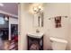 Small bathroom with mirror, vanity with storage, and tile floor at 1600 Olive St, Denver, CO 80220