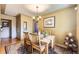 Comfortable dining room featuring hardwood floors, a chandelier, and a classic rug at 1600 Olive St, Denver, CO 80220
