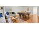 Well lit game room features a beautiful pool table and a cozy sitting area with a decorative rug at 1600 Olive St, Denver, CO 80220